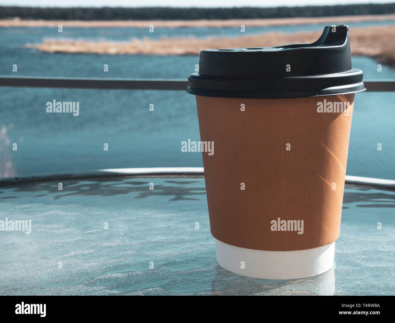 paper cup of coffee from paper on glass table morning background. Film ...