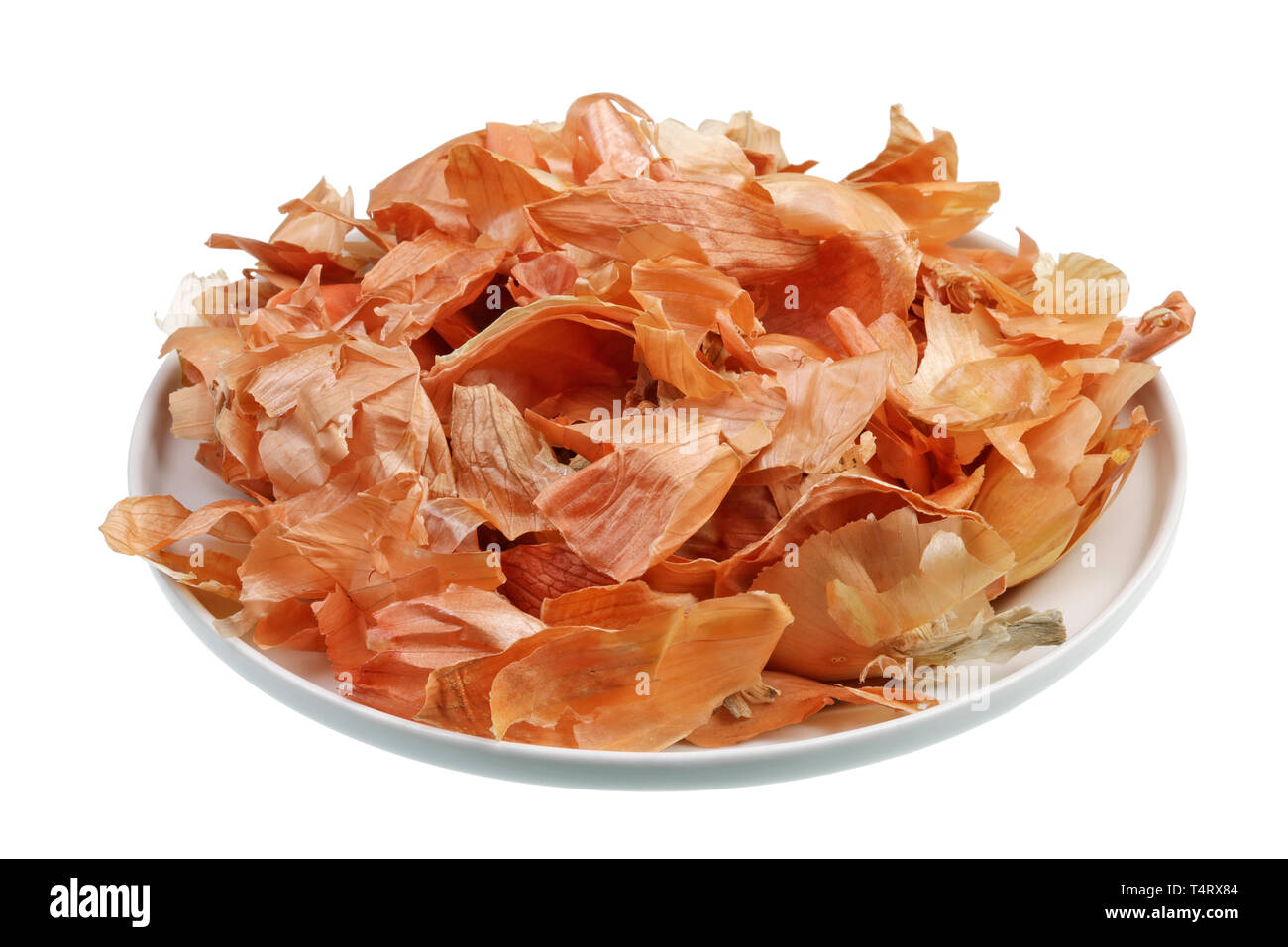 Dry onion peel is used to treat hemorrhoids and paint in red colors  of  Easter eggs. Isolated on white studio macro shot Stock Photo