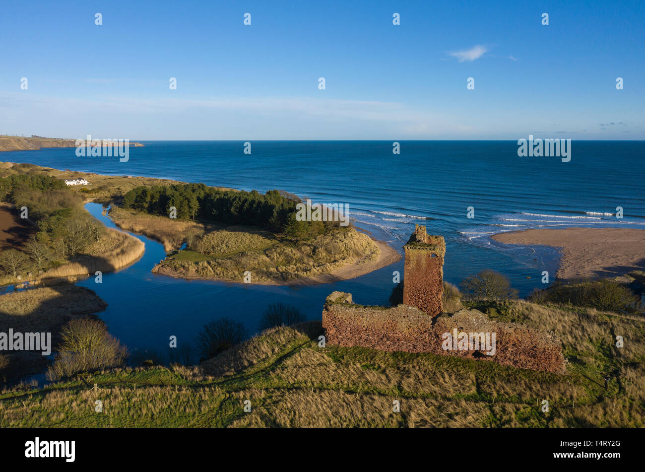 Aerial view over Red Castle at Lunan Bay (high tide), Angus, Scotland. Stock Photo