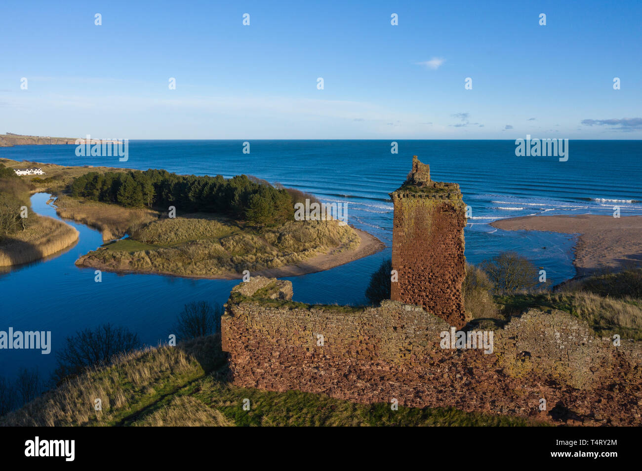 Aerial view over Red Castle at Lunan Bay (high tide), Angus, Scotland. Stock Photo