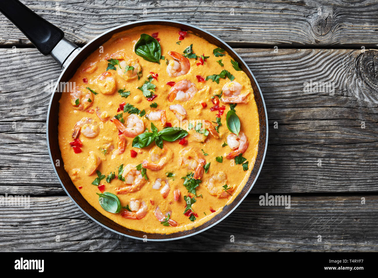creamy, and comforting One Pot Shrimps in Coconut Sauce with blended vegetables, camarao no leite de coco, brasil recipe, view from above, flatlay, cl Stock Photo
