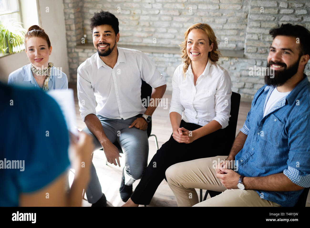 Happy creative team in office. Business, startup, design, people and teamwork concept Stock Photo