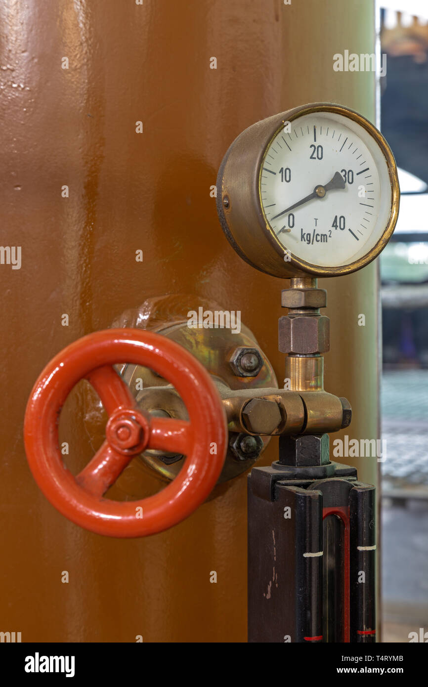 Measuring instrument on a historic generator in an old power plant in Germany Stock Photo