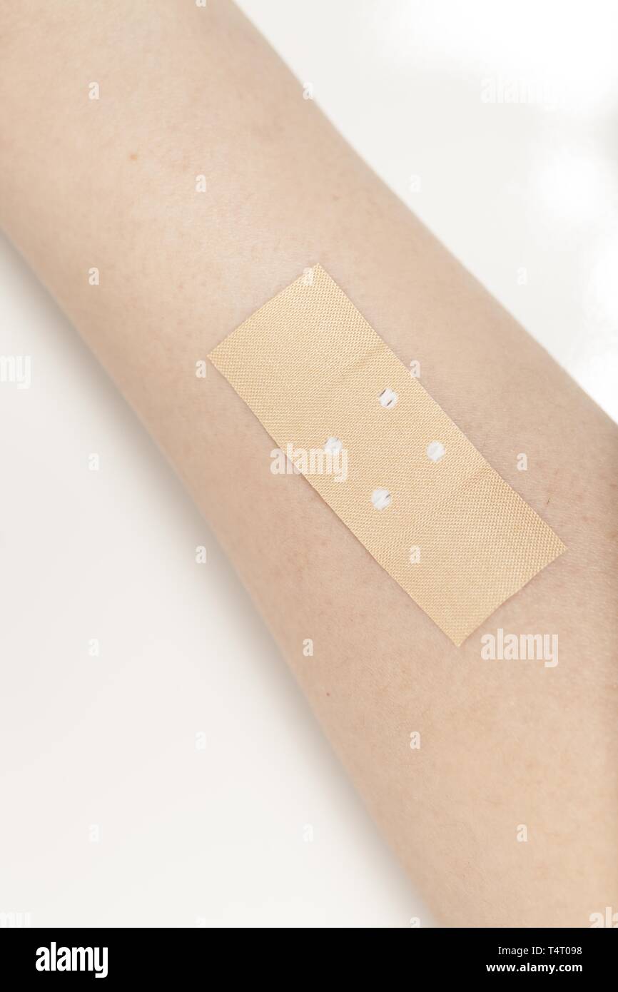Plaster on arm Stock Photo