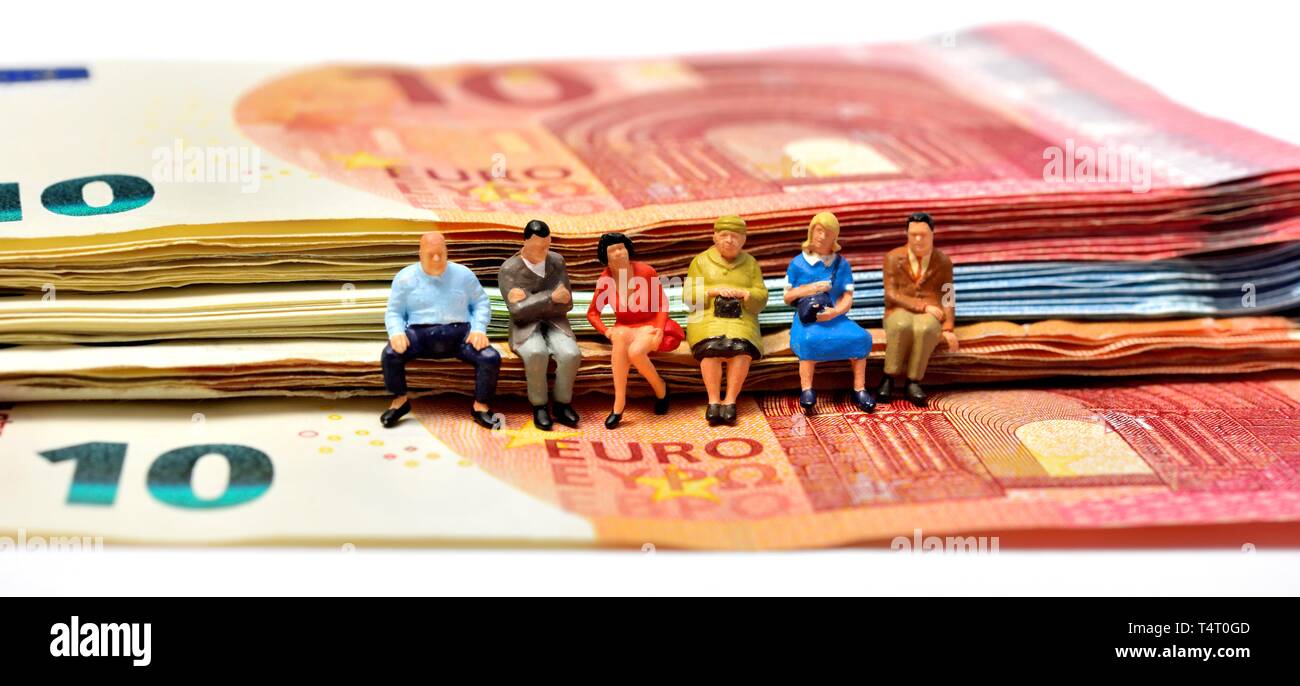 Miniature figurines, sitting on euro notes,currency, Stock Photo