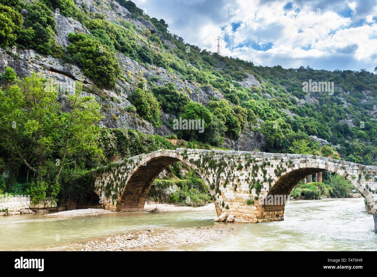 Old Mamluk stone bridge in Nahr el Kalb, Lebanon Stock Photo
