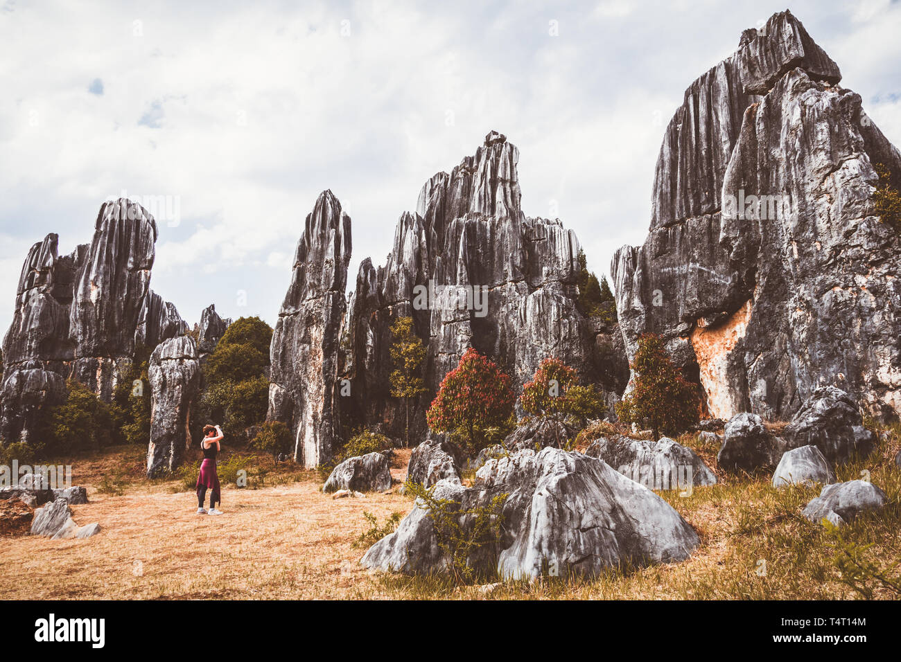 Female tourist in stone forest around Kunming Stock Photo - Alamy