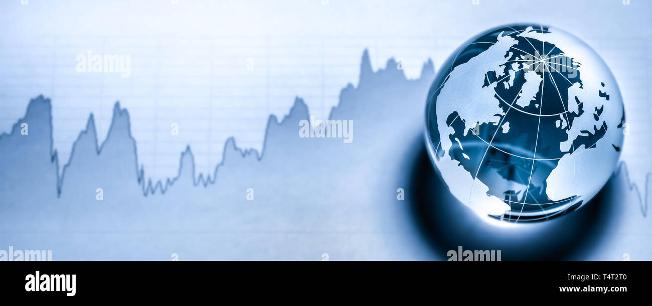 Crystal Earth On Stock market Graph - Global Economy Concept Stock Photo