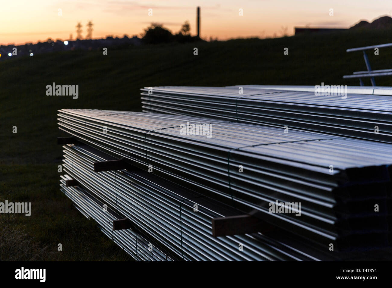 Stack metal waiting to be installed into new development. Stock Photo
