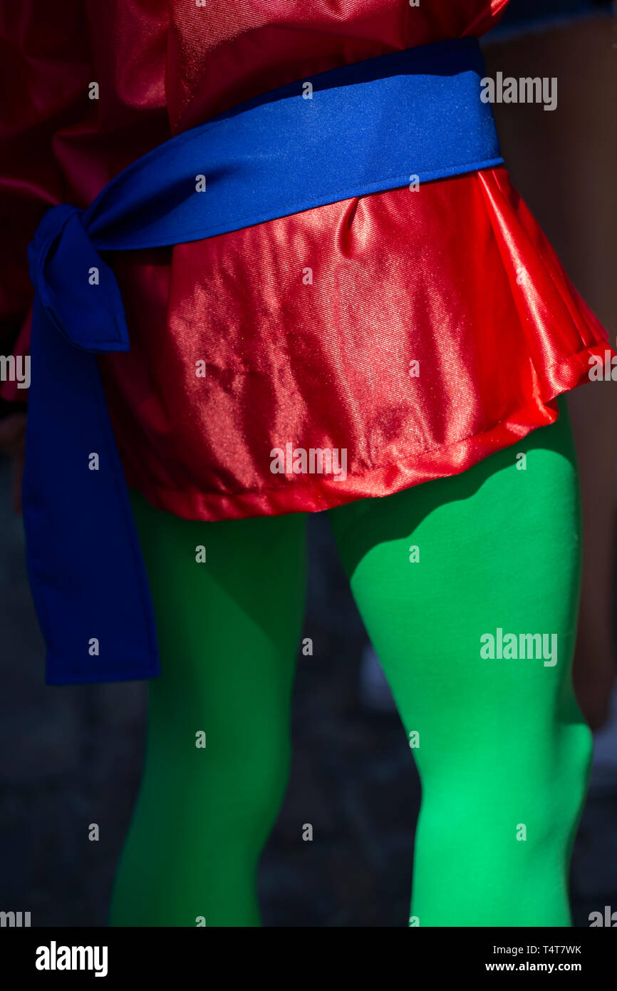 Man disguised wearing green tights Stock Photo