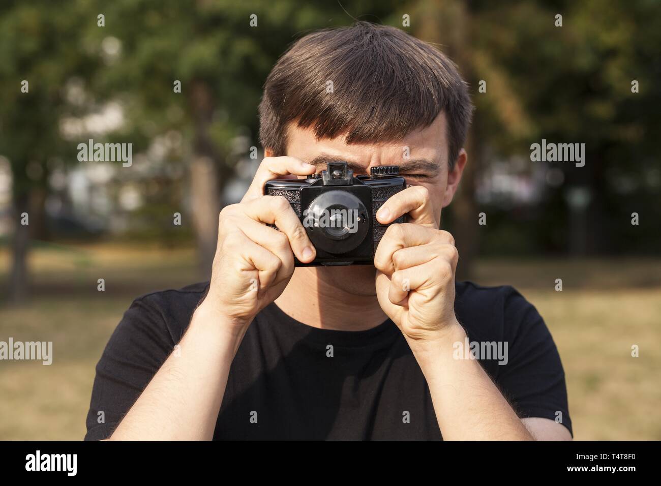 Young man is taking pictures, Germany Stock Photo