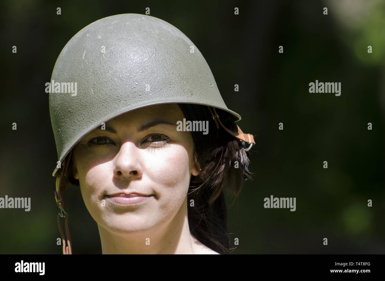 Happy military woman in helmet hi-res stock photography and images - Alamy