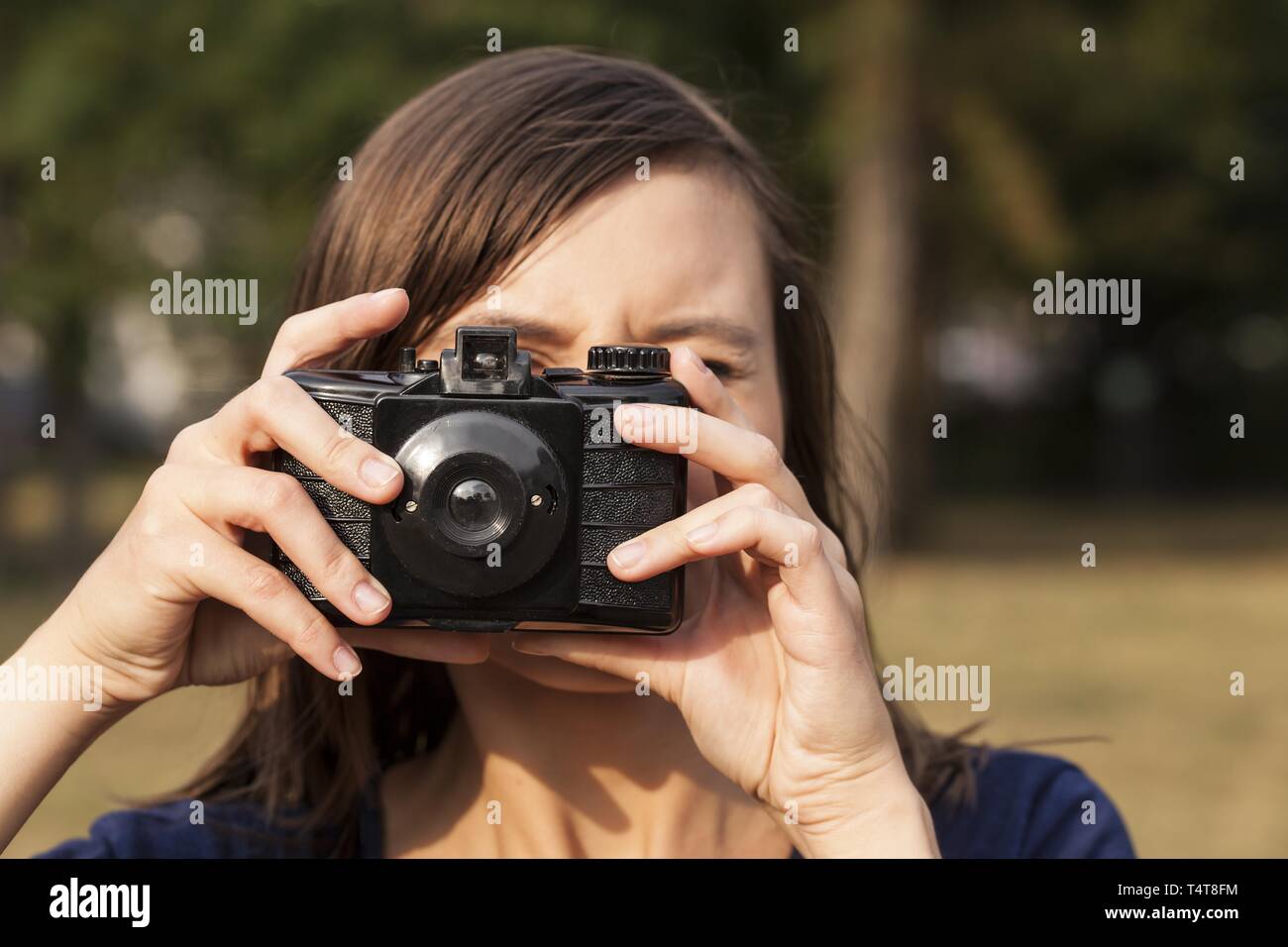 Young woman photographing, Germany Stock Photo