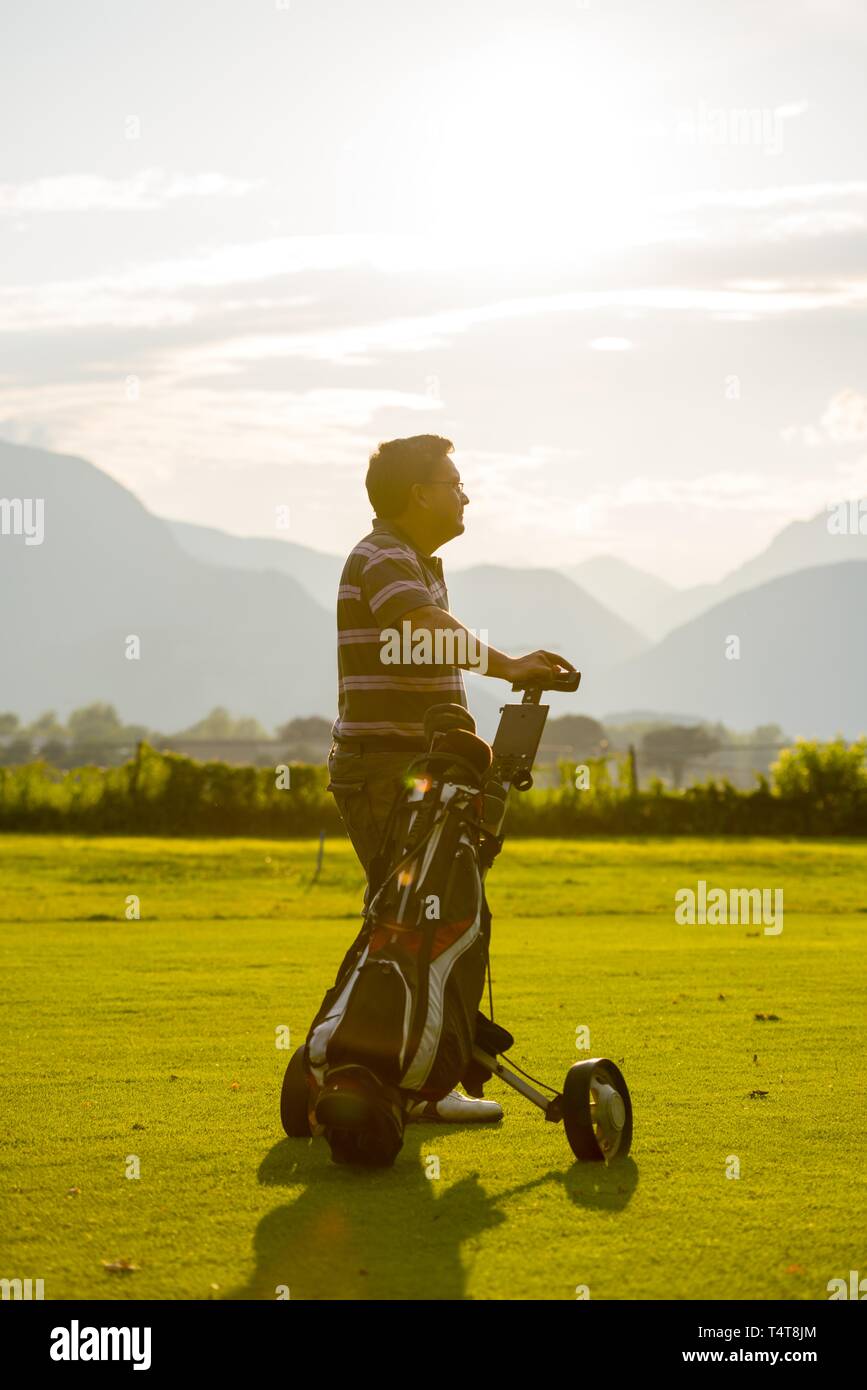 Golfer with his golf bag on the fairway, Switzerland, Europe Stock Photo