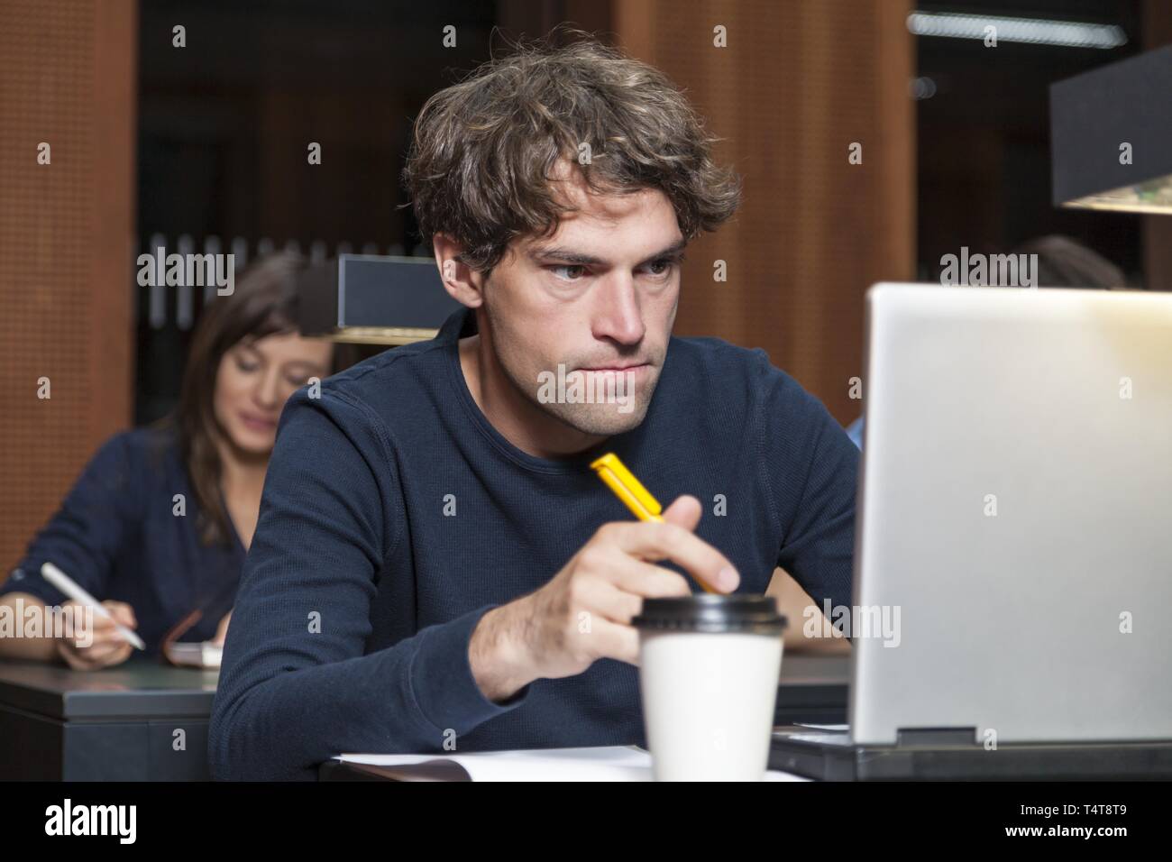 Student working on a laptop Stock Photo