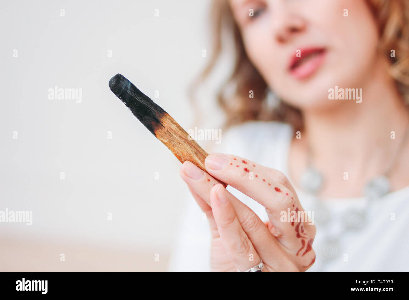 Young woman holding incense sticks hi-res stock photography and images ...