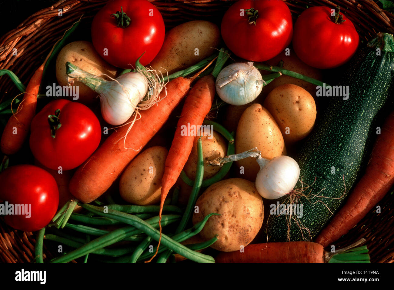 Fresh vegetables in wicker basket Stock Photo