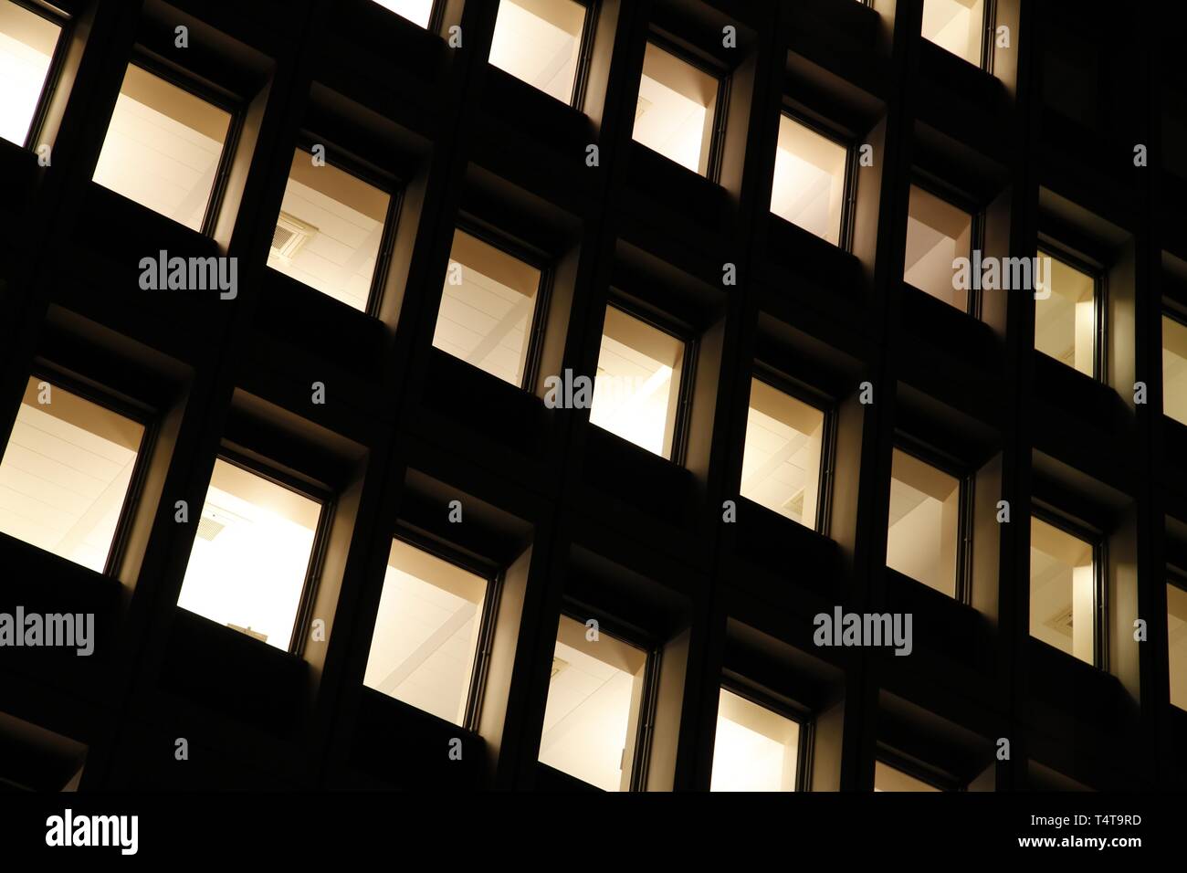 Windows at night, office building Stock Photo