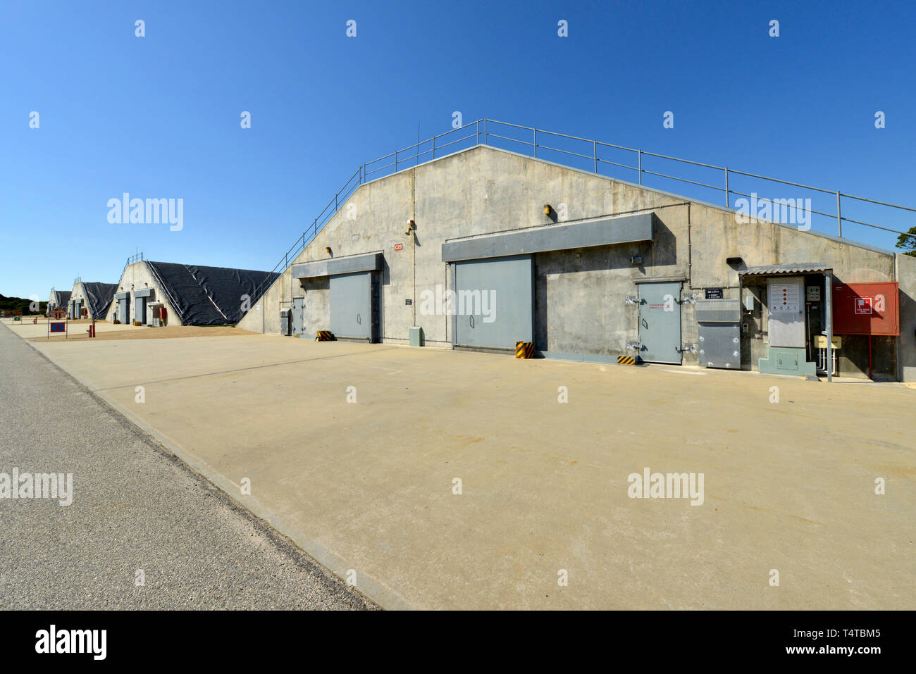A naval concrete weapons storage bunker at a naval base housing artillery shells, missiles and torpedos. Stock Photo