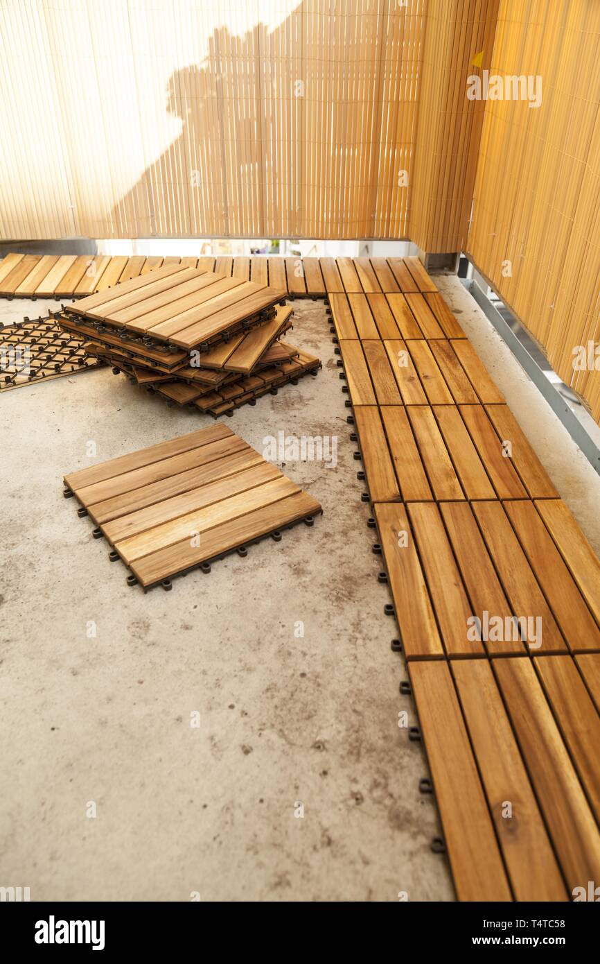 Laying Of Wooden Patio Tiles On A Balcony Germany Europe Stock