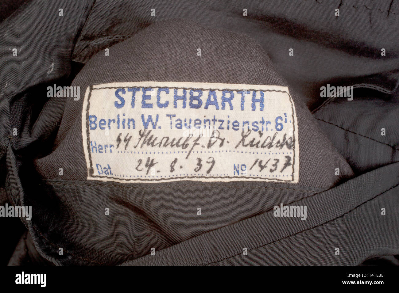 THE JOHN PEPERA COLLECTION, An Evening Dress Jacket of SS-Sturmbannführer Dr. Lüdcke, Tailor-made black wool doeskin double-breasted waist jacket with open collar and black silk lapels, silver/aluminium cord trim on the collar and cuffs, silver/aluminium buttons with runes and wreath in raised relief. Black wool collar tabs edged in silver/aluminium cord, plain on the right side, four rank pips on the left. Silver/aluminium interwoven cord shoulder boards on black wool background, red wool and silk grosgrain armband bordered in silver/aluminium cord, an Old Fighter's chevro, Editorial-Use-Only Stock Photo