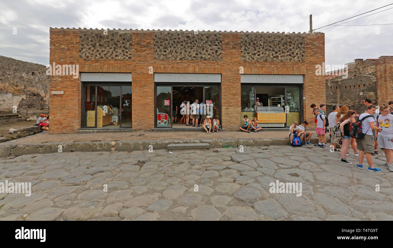 Pompei, Italy - June 25, 2014: Bunch of Tourists at Autogrill Restaurant in Ancient Roman Ruins Near Naples, Italy. Stock Photo