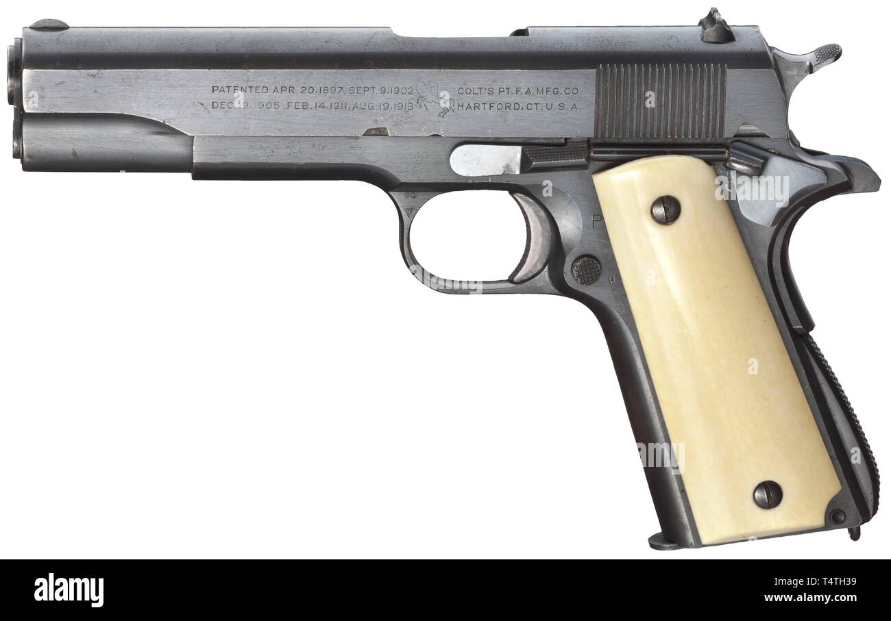 A Colt mod. 1911 A 1, navy, cal..45 ACP, no. 715233. Bright bore. Made in 1939. Modified, shorter hammer with wider spur. Inspectorïs acceptance mark 'H' for Frederick W. Hauff. Complete, original, matt Colt-blue, partially minimally spotted. Ivory grip panels slightly darkened due to age. Correct contemporary magazine with untouched carrier. Only handled with greatest care, almost mint overall condition. Rare collectorïs item. Note: All 3.636 pistols within the serial range of 713646 - 717281 which were manufactured by Colt in 1939 were due to f, Additional-Rights-Clearance-Info-Not-Available Stock Photo
