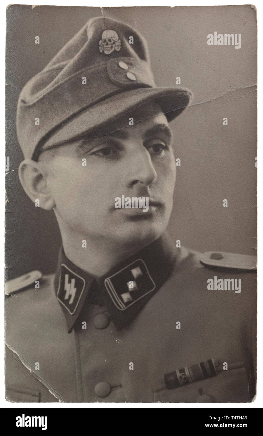 3rd SS Totenkopf Standarte Thuringia - an SS deathïs head ring of Hauptsturmführer Johann Cesinger. Silver with the inside surface engraved 'S.lb. Cesinger 21.6.40 H.Himmler'. Worn condition. Including Cesingerïs questionnaire, four 'POW' letters (from Dachau and Bad Aibling) and two copy photos. Cesinger (SS no. 16332) was assigned to 6th SS Mountain Division 'Nord' from May 1942. The ring comes directly from family possession and has never before been in the hands of a collector. historic, historical, 20th century, 1930s, 1940s, Waffen-SS, armed division of the SS, armed , Editorial-Use-Only Stock Photo