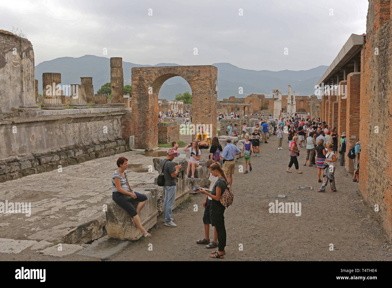 Pompei, Italy - June 25, 2014: Bunch of Tourists at Ancient Roman Temple Ruins World Heritage Site Near Naples, Italy. Stock Photo