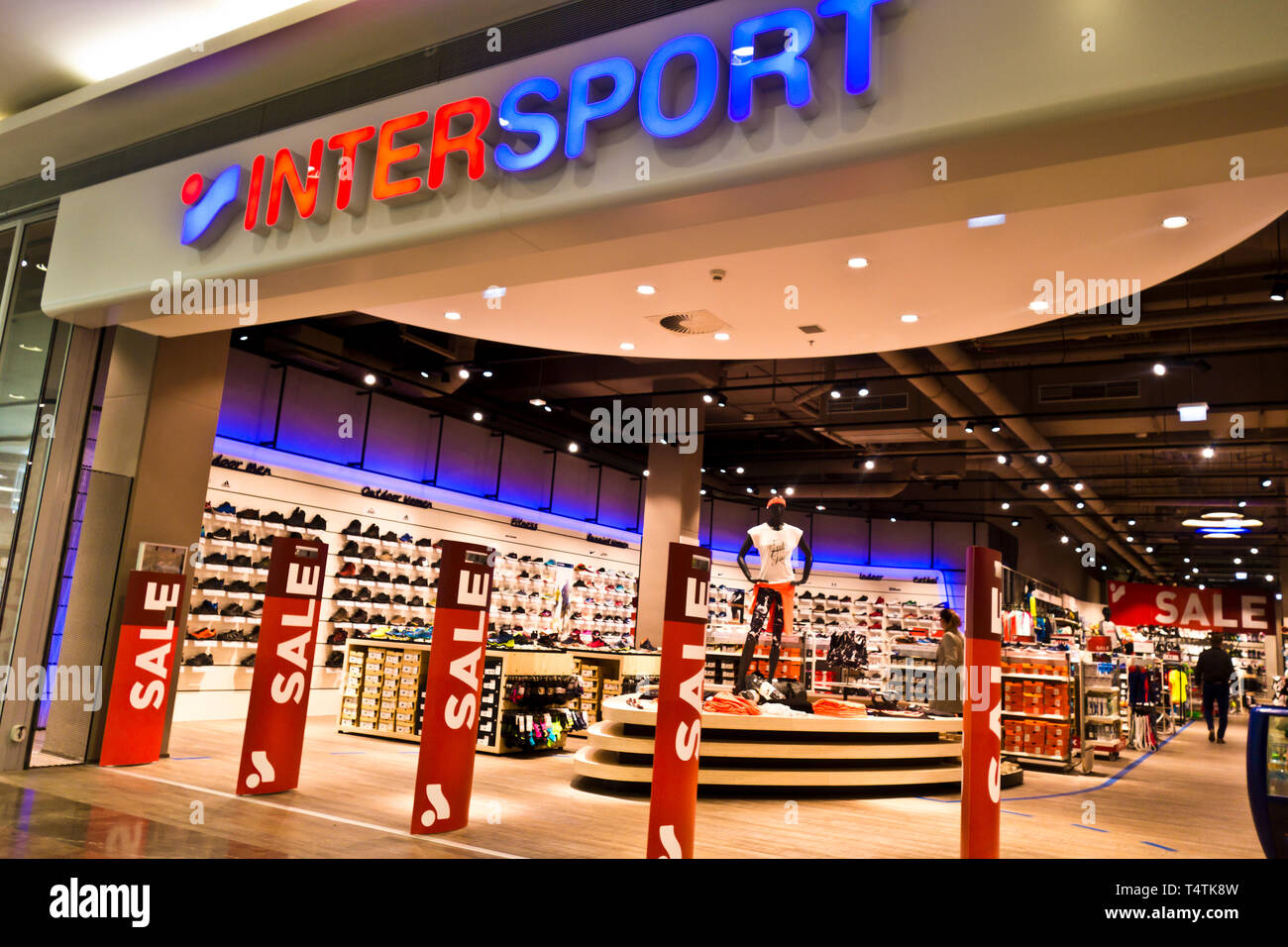 entrance of an Intersport store with Sale signs Stock Photo - Alamy