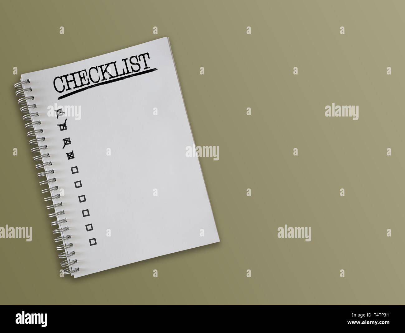 directly above shot of checklist on spiral-bound notepad Stock Photo