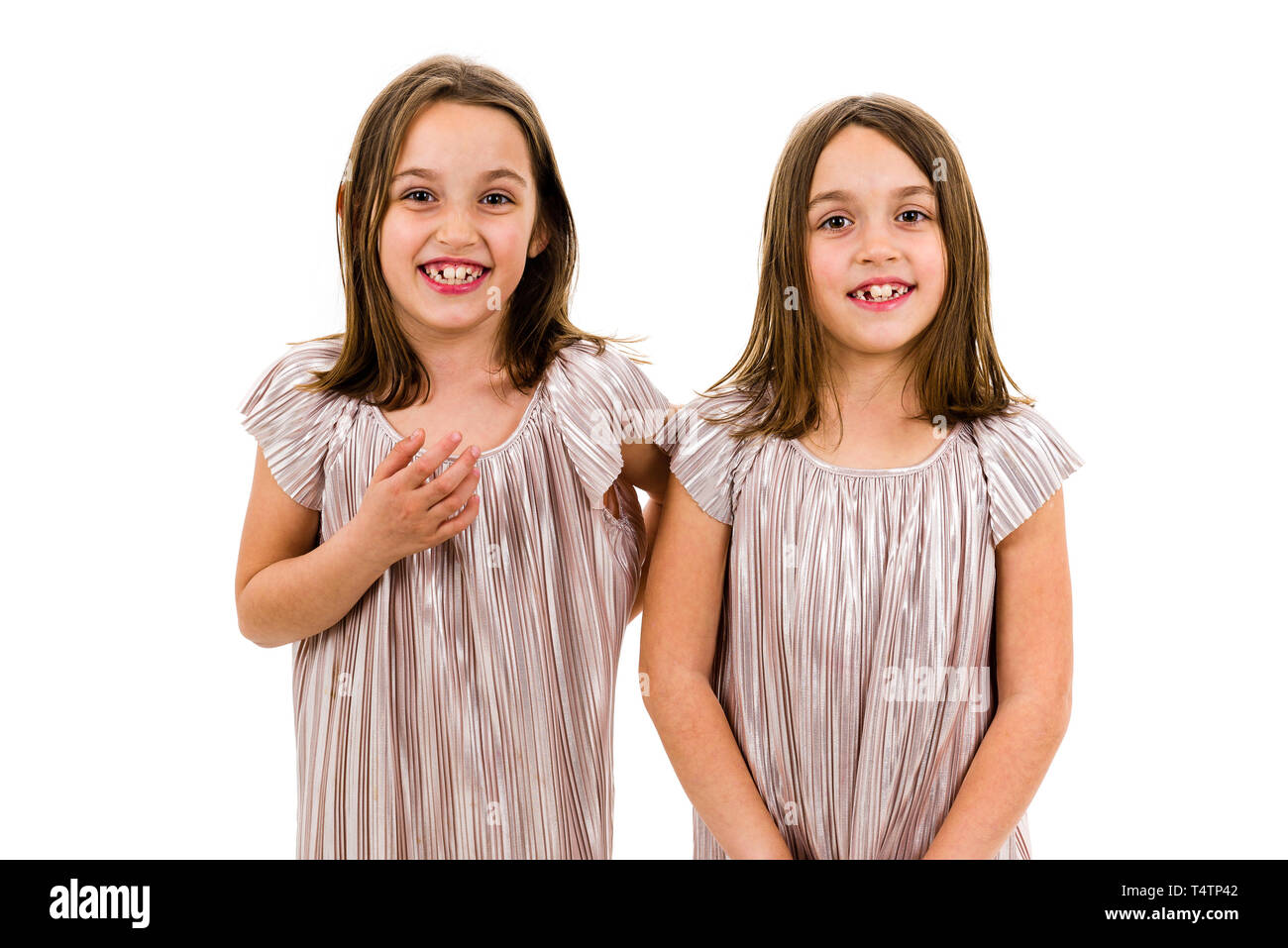 Lifestyle portrait identical twin sisters Cut Out Stock Images