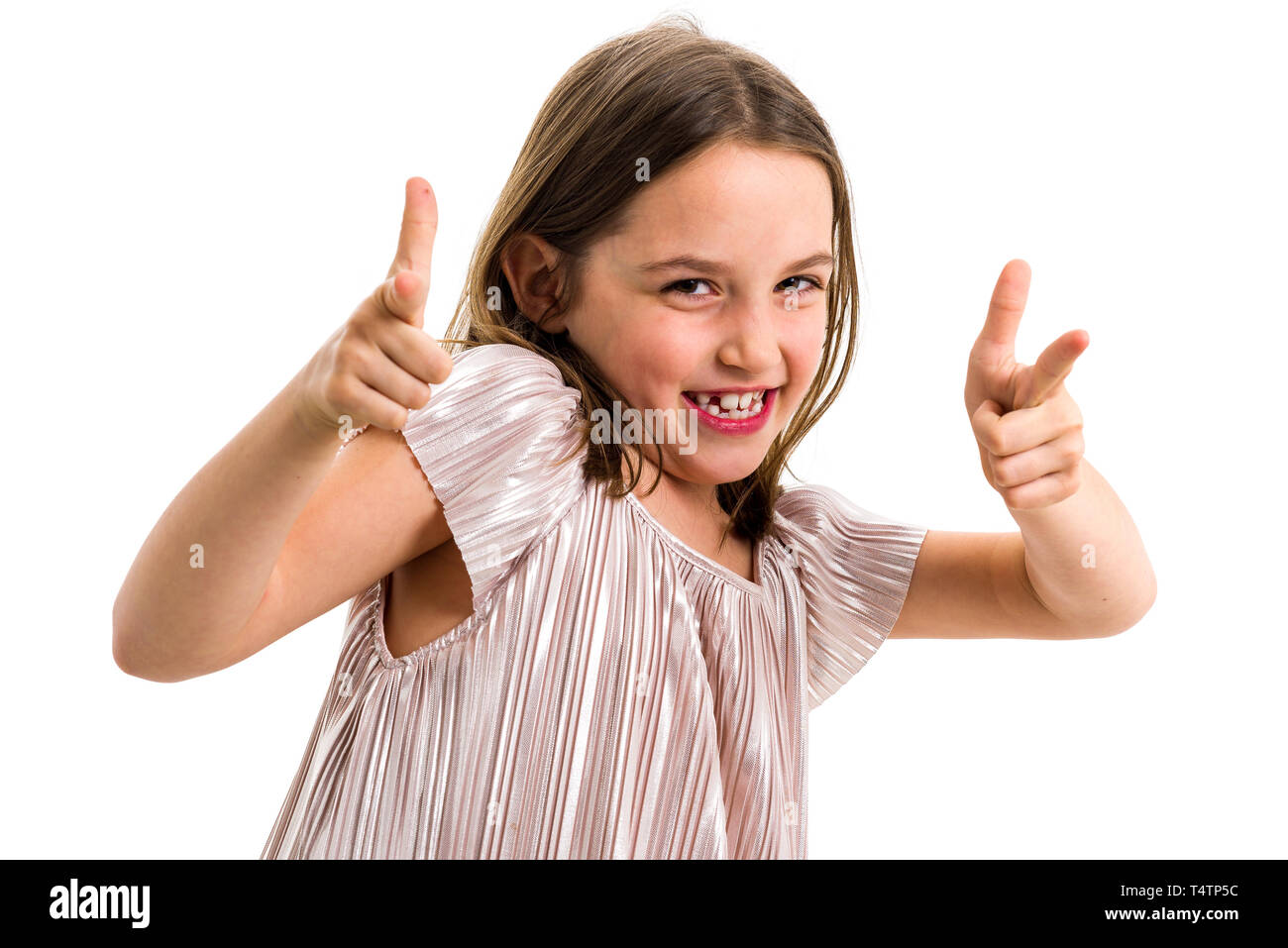 Portrait of happy girl pointing finger gun gesture at camera. Portrait of a cheerful cute little child girl looking at the camera, smiling and pointin Stock Photo