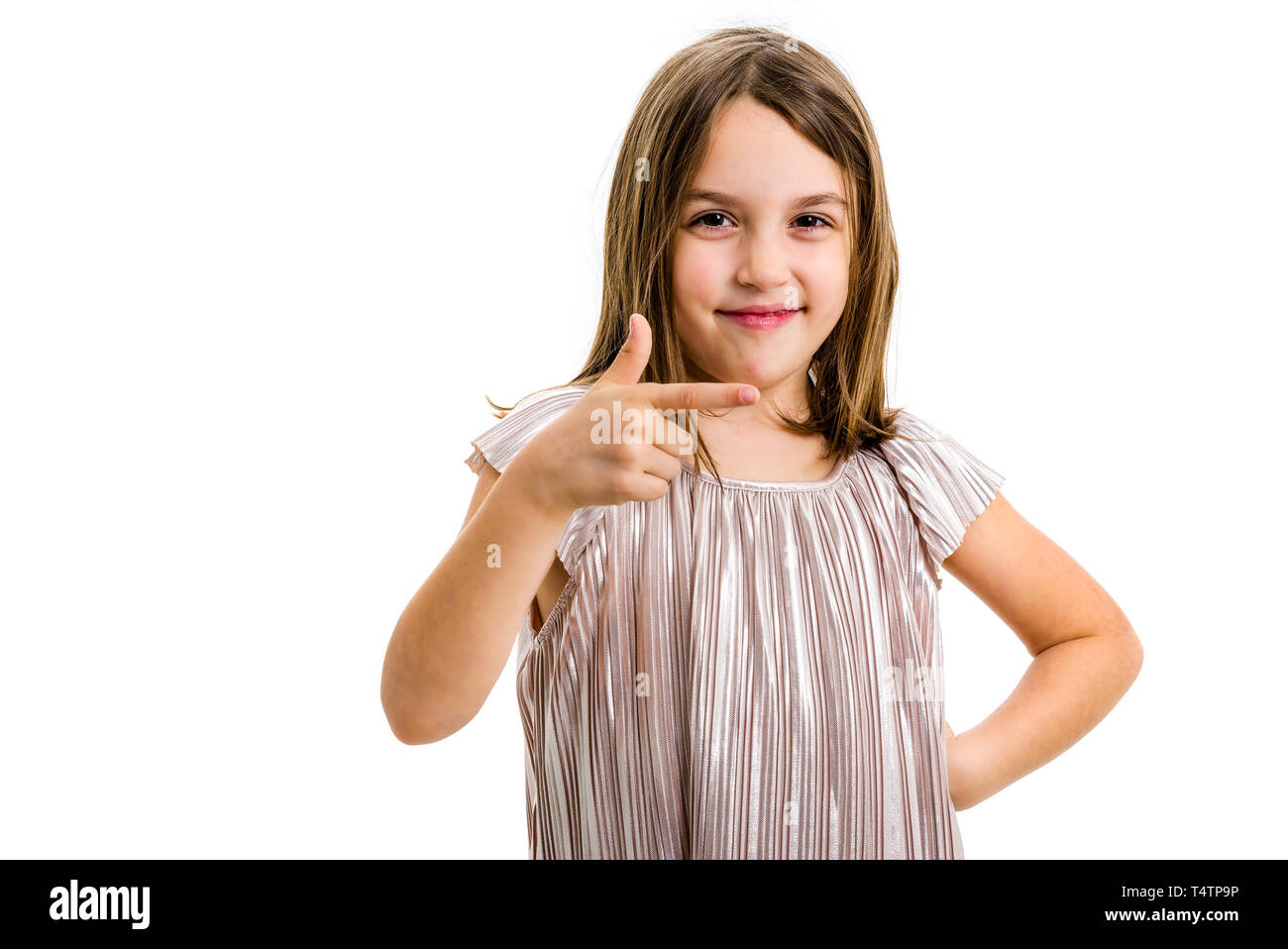 Portrait of happy girl pointing finger gun gesture at camera. Portrait of a cheerful cute little child girl looking at the camera, smiling and pointin Stock Photo