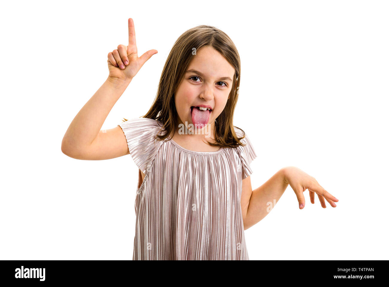 Portrait of happy girl making loser hand gesture at camera. Portrait of a cheerful cute little child girl looking at the camera, smiling showing L sig Stock Photo