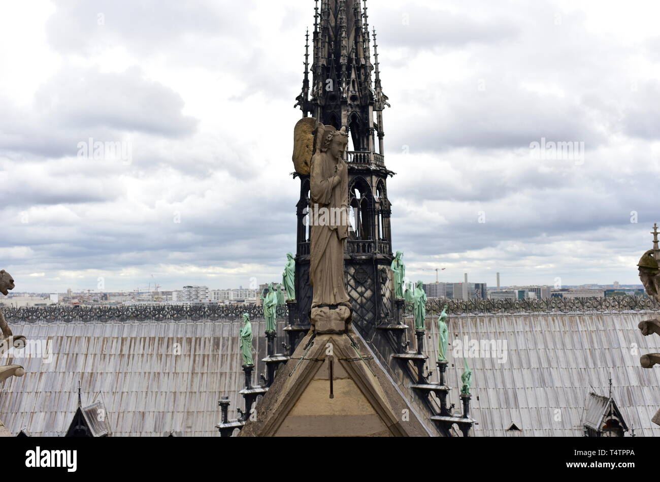 Notre Dame Spire, La Fleche, and lead clad wooden roofs before the fire.  Angel statue, Apostles and Evangelists. Paris, France Stock Photo - Alamy