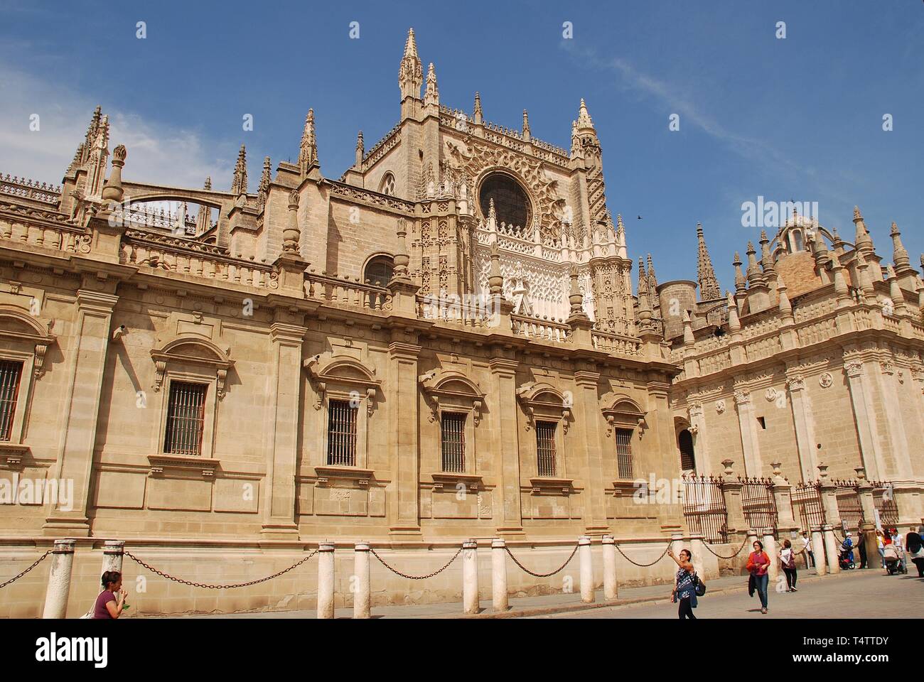 The cathedral of Santa Maria de la Sede in Seville, Spain on April 2, 2019. Begun in 1402, it is the largest gothic cathedral in the World. Stock Photo