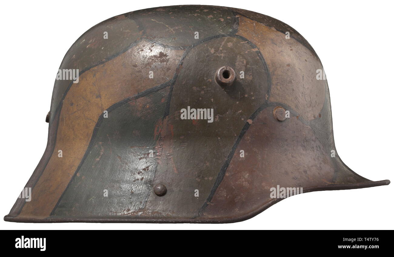 A steel helmet M 16 with camouflage paint. Fieldgrey painted steel