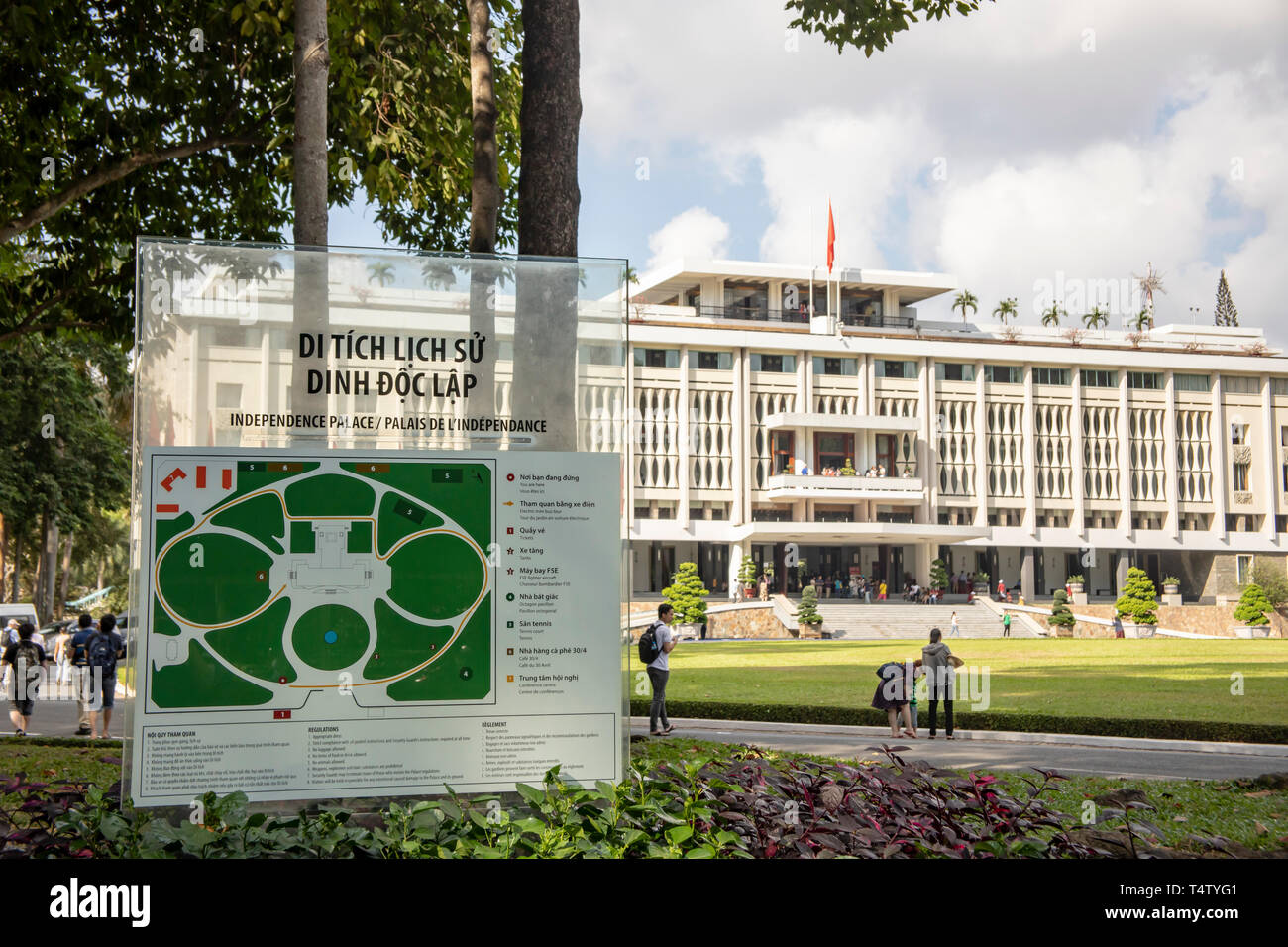 Ho Chi Minh City, Vietnam - March 9, 2019 :  Sign and tourists outside Reunification, or Independence, Palace in Ho Chi Minh City, or Saigon, Vietnam. Stock Photo