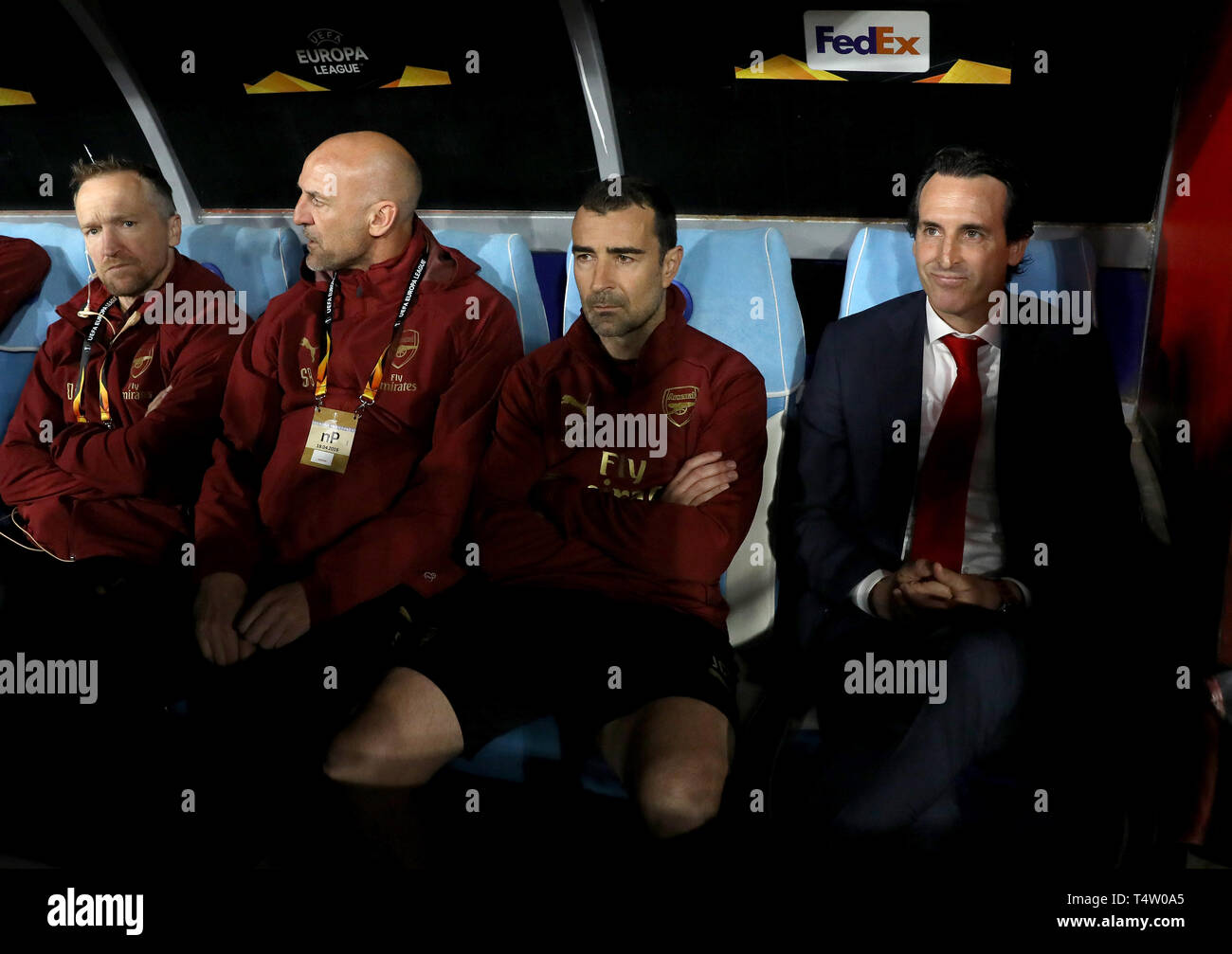Left to right, Arsenal director of performance Darren Burgess, assistant manager Steve Bould, assistant manager Juan Carlos Carcedo and manager Unai Emery during the UEFA Europa League quarter final second leg match at the San Paolo Stadium, Naples. Stock Photo