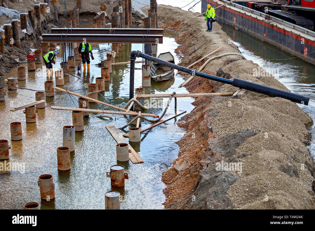 Workers welding and grinding in wet conditions. Abstract Dangers of