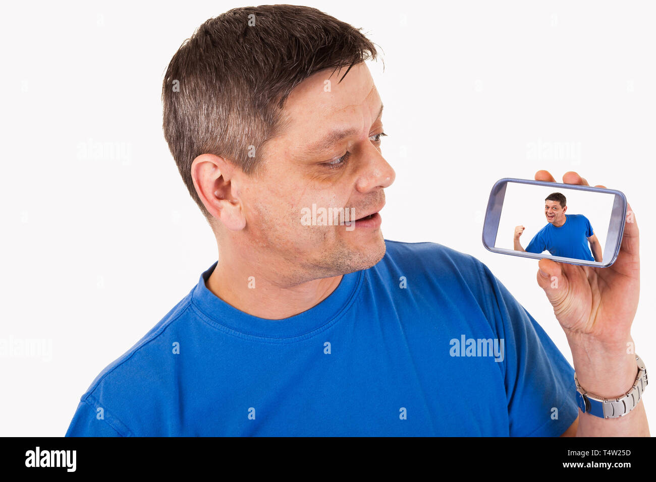 A man with self-portrait on his mobile phone - isolated Stock Photo