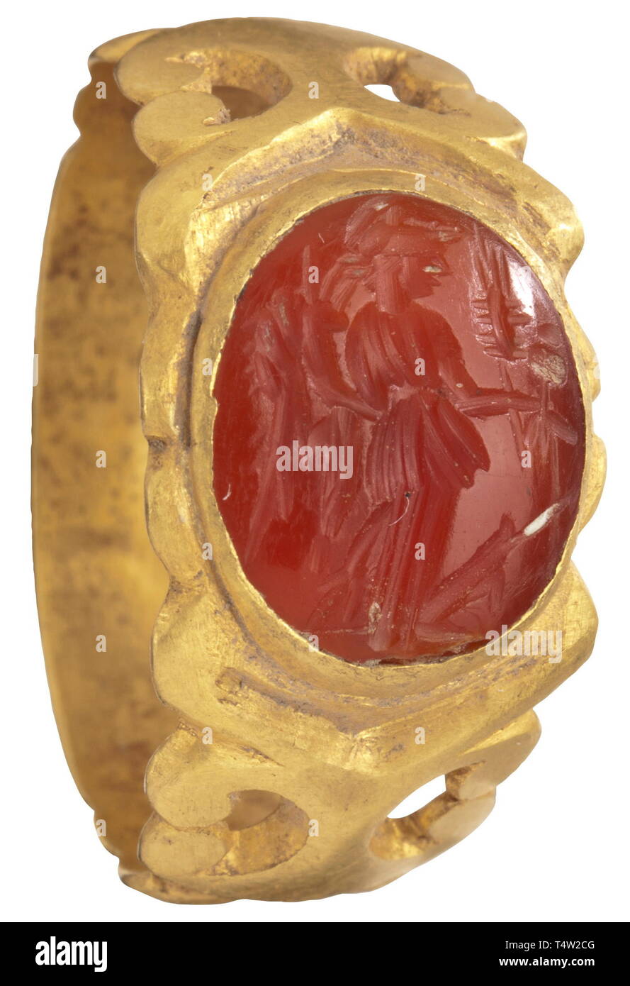 A Roman gold ring with Fortuna gem, 2nd/3rd century AD. Wide band with ornamental openwork, set with a carnelian. On the upper side a cut depiction of Fortuna. Width 2.3 cm, weight 9.83 g. Provenance: South German private collection, 1970s and later. historic, historical, Roman Empire, ancient world, ancient times, ancient world, Additional-Rights-Clearance-Info-Not-Available Stock Photo