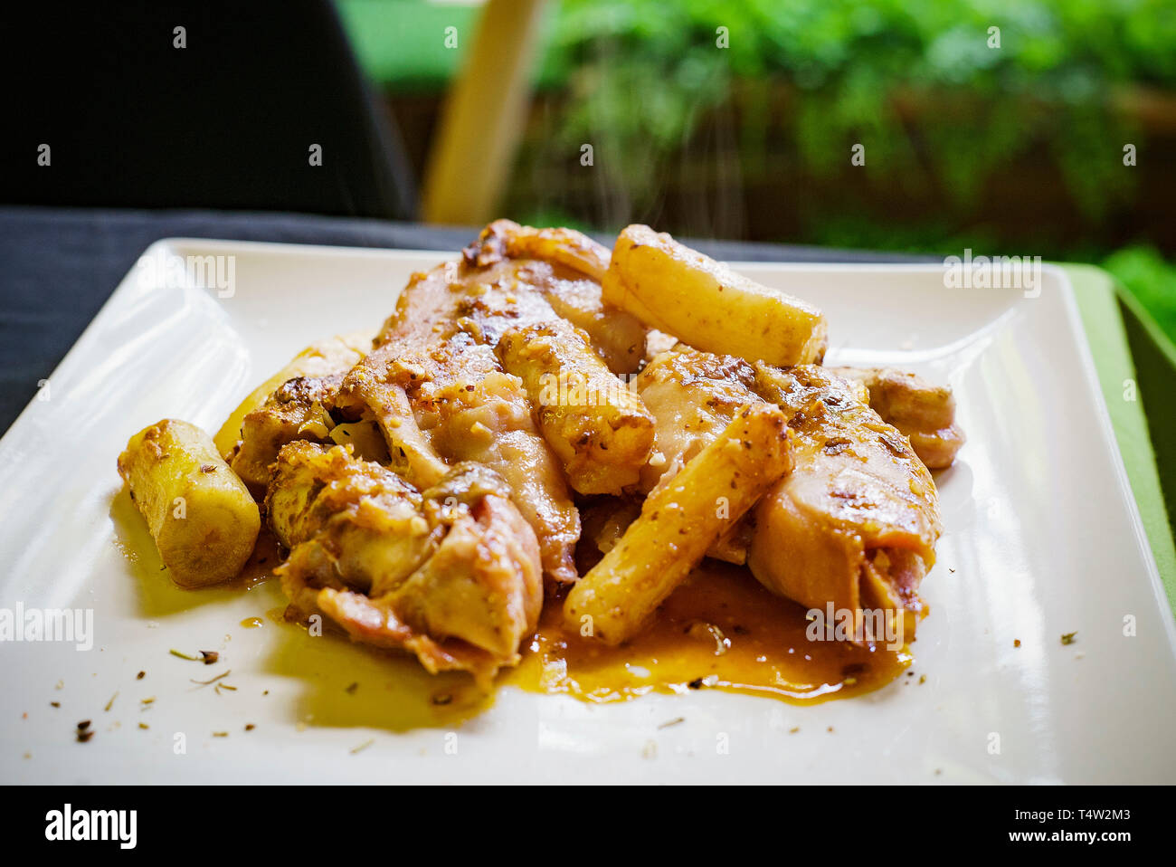 Pies de cerdo with salsafin(tuber sauce).pig trotters with salsafin. Pineda de Mar. Catalunya. Spain Stock Photo