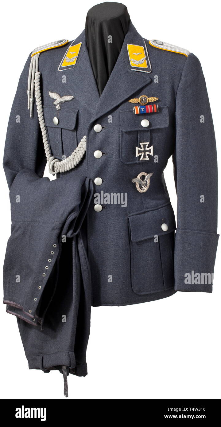 A walking-out uniform for a lieutenant of the flying corps. A coat of  Luftwaffe blue gabardine with silver collar cord and buttons,  silver-embroidered insignia and silver adjutantïs lanyard, the silk lining  with