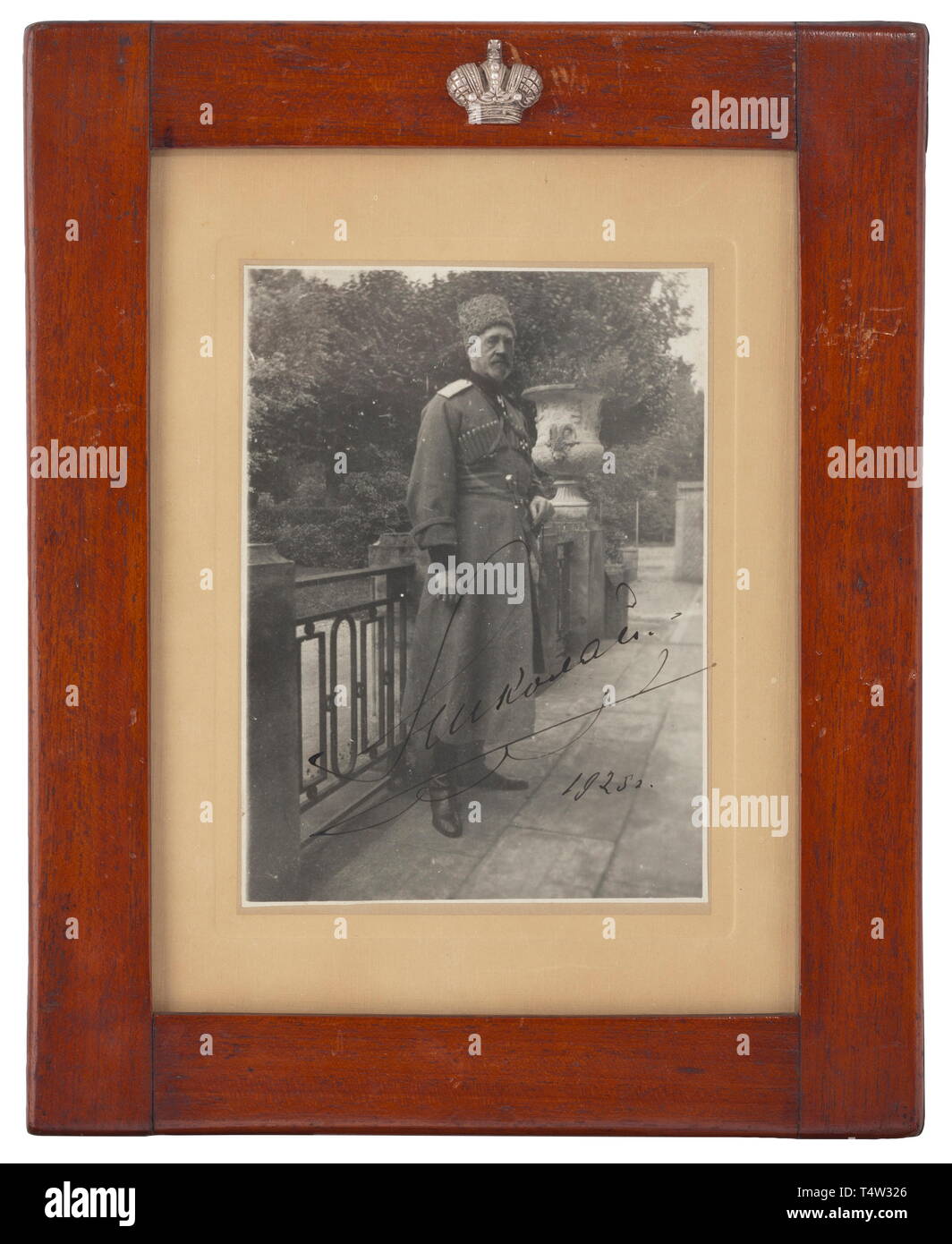 A portrait photograph of the Grand Duke Nicholas Nikolaevich Romanov with his handwritten ink signature. France, 1925. Under glass, in brown lacquered wooden frame with an applied silver-plated tsarïs crown at top. Picture dimensions circa 17 x 12.8 cm. Framed dimensions 30.5 x 24.8 cm. Rare. Grand Duke Nicholas Nikolaevich Romanov (1856 - 1929) was a grandson of Tsar Nicholas I, Supreme Commander of the Russian forces in the First World War. He died at the French Riviera in 1929. historic, historical, 20th century, Additional-Rights-Clearance-Info-Not-Available Stock Photo