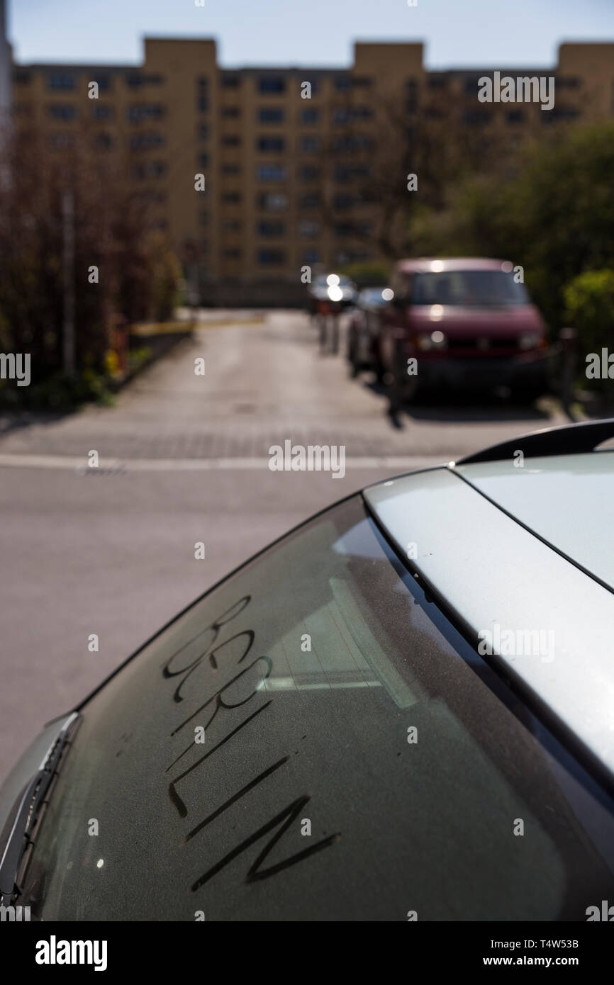 The word 'Berlin' written in dust on a car's rear windscreen in Berlin