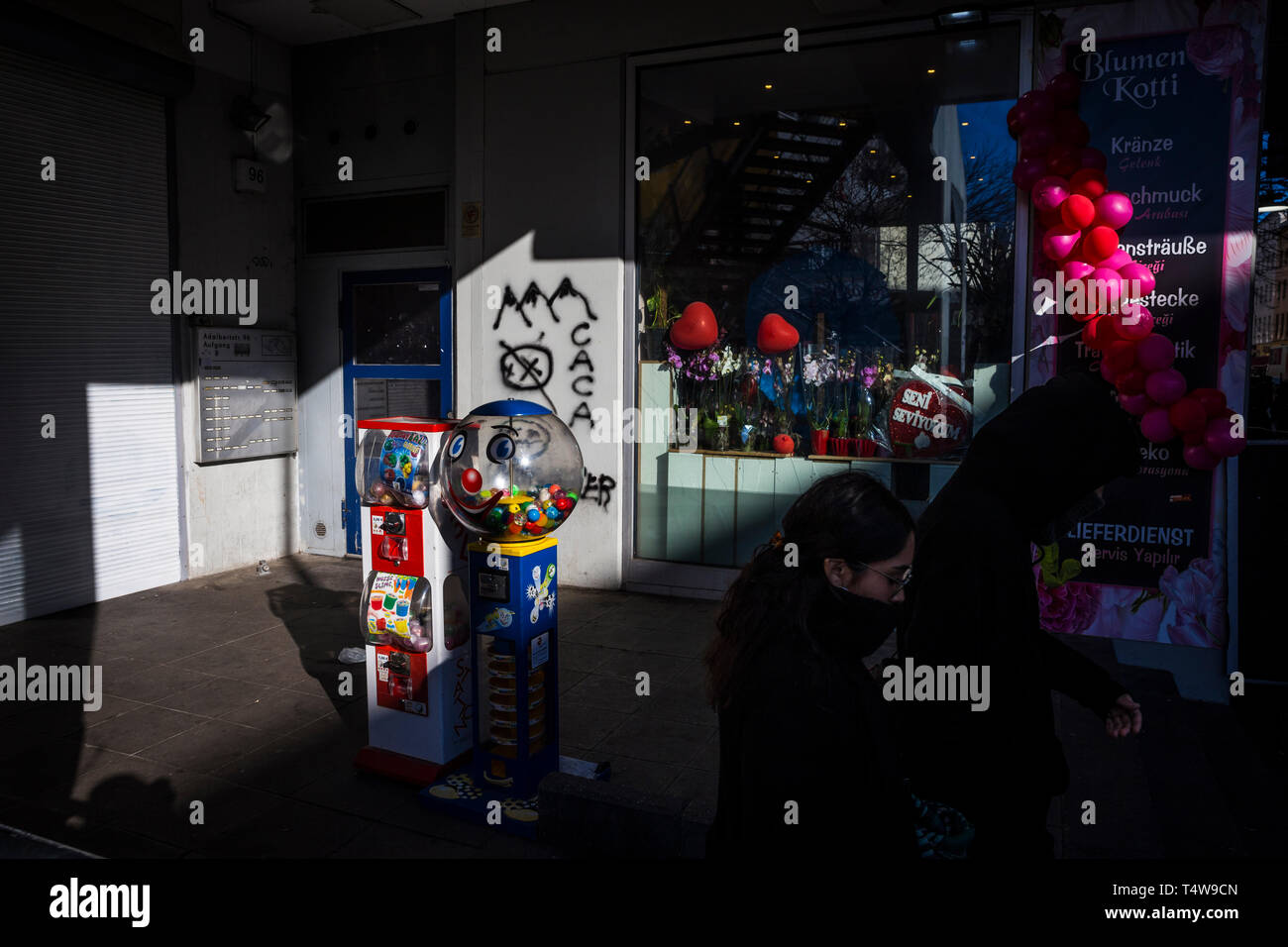 Sweet dispensers and balloons outside a shop in Kottbusser Tor, Berlin, Germany. Stock Photo