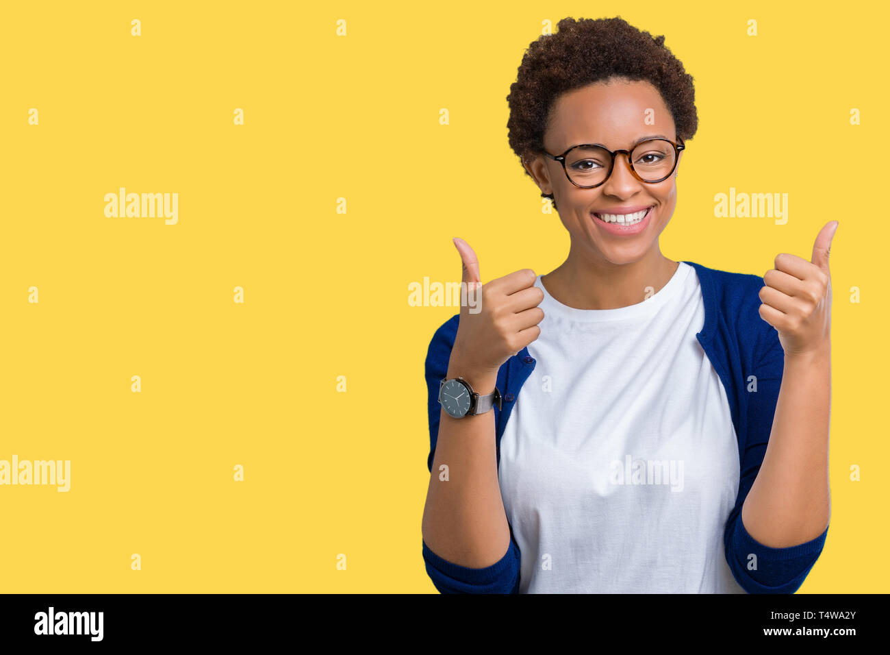 Young beautiful african american woman wearing glasses over isolated ...