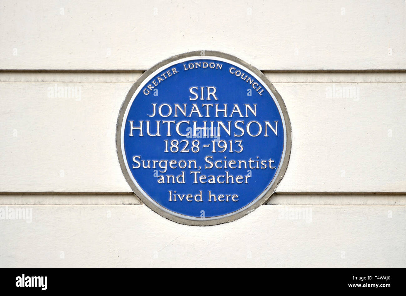 London, England, UK. Commemorative Blue Plaque: Sir Jonathan Hutchinson (1828-1913) Surgeon, Scientist, Teacher - 15 Cavendish Square, Marylebone, Lon Stock Photo